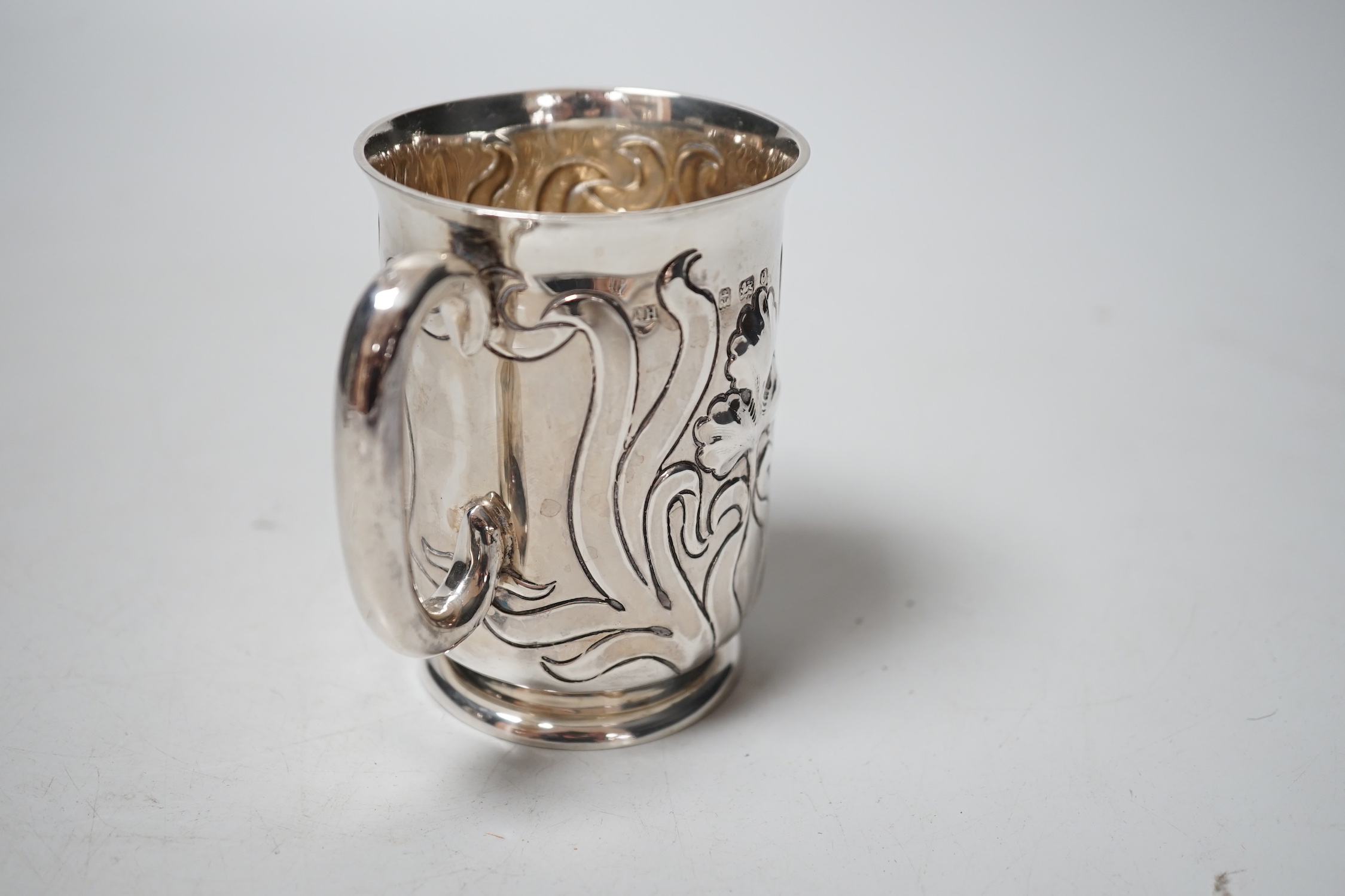 An Art Nouveau silver christening mug, Thomas Hayes, Birmingham, 1904, 89mm.